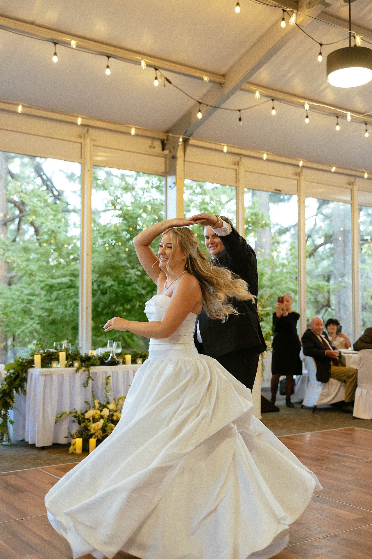 Drew spins Ally during their first dance in the tent