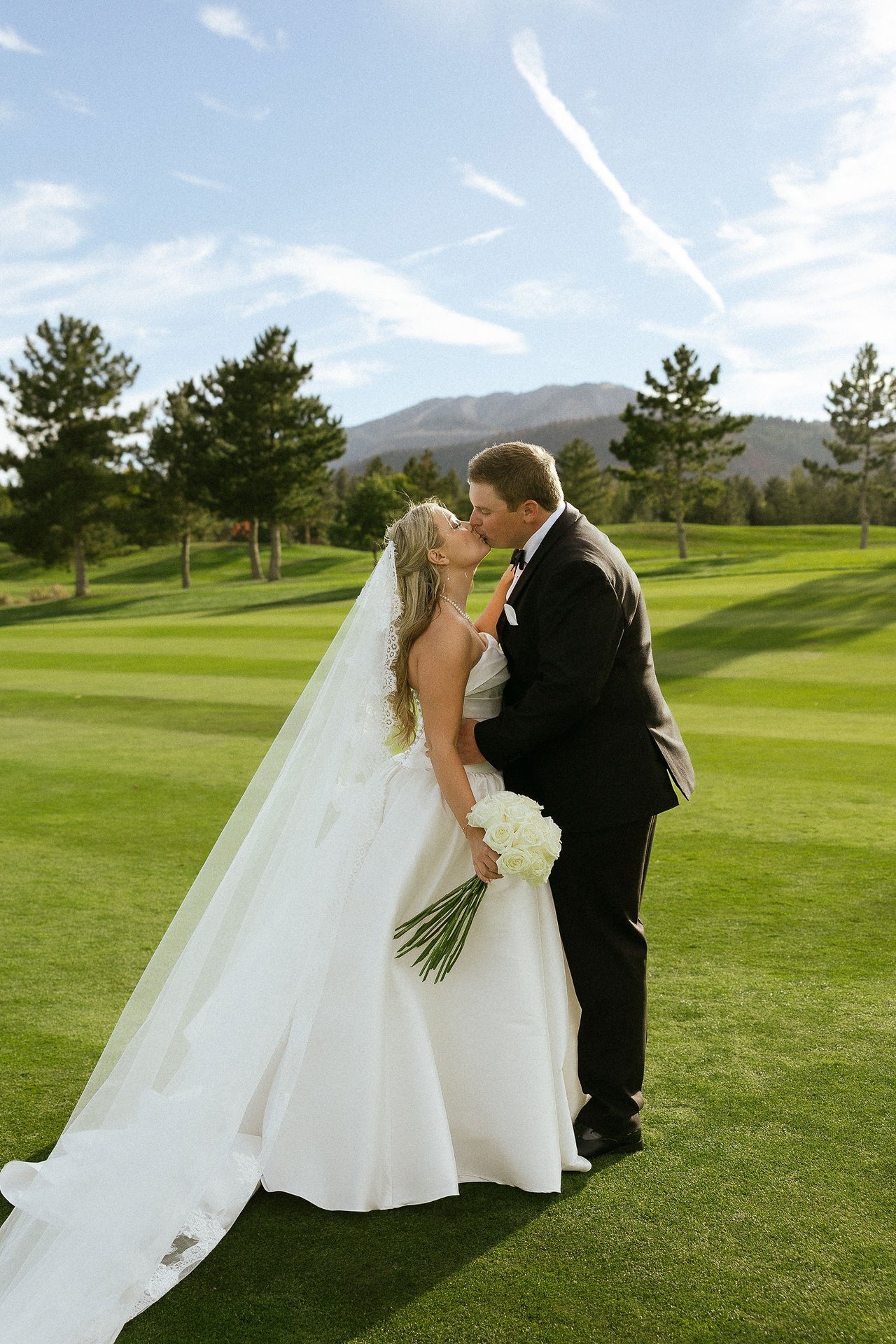 Ally and Drew kiss on the fairway