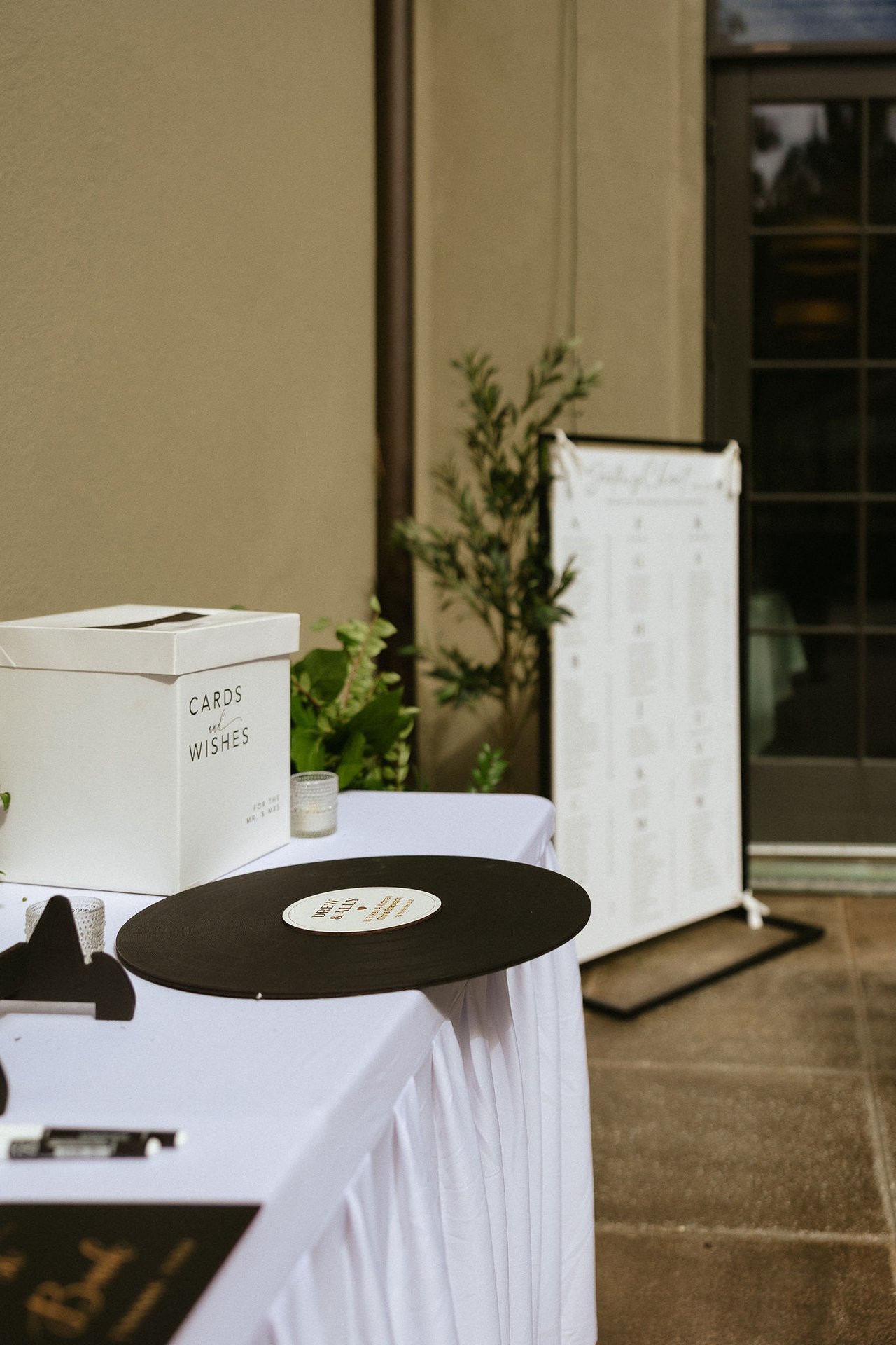 The cards box, the vinyl record guest book and the seating chart