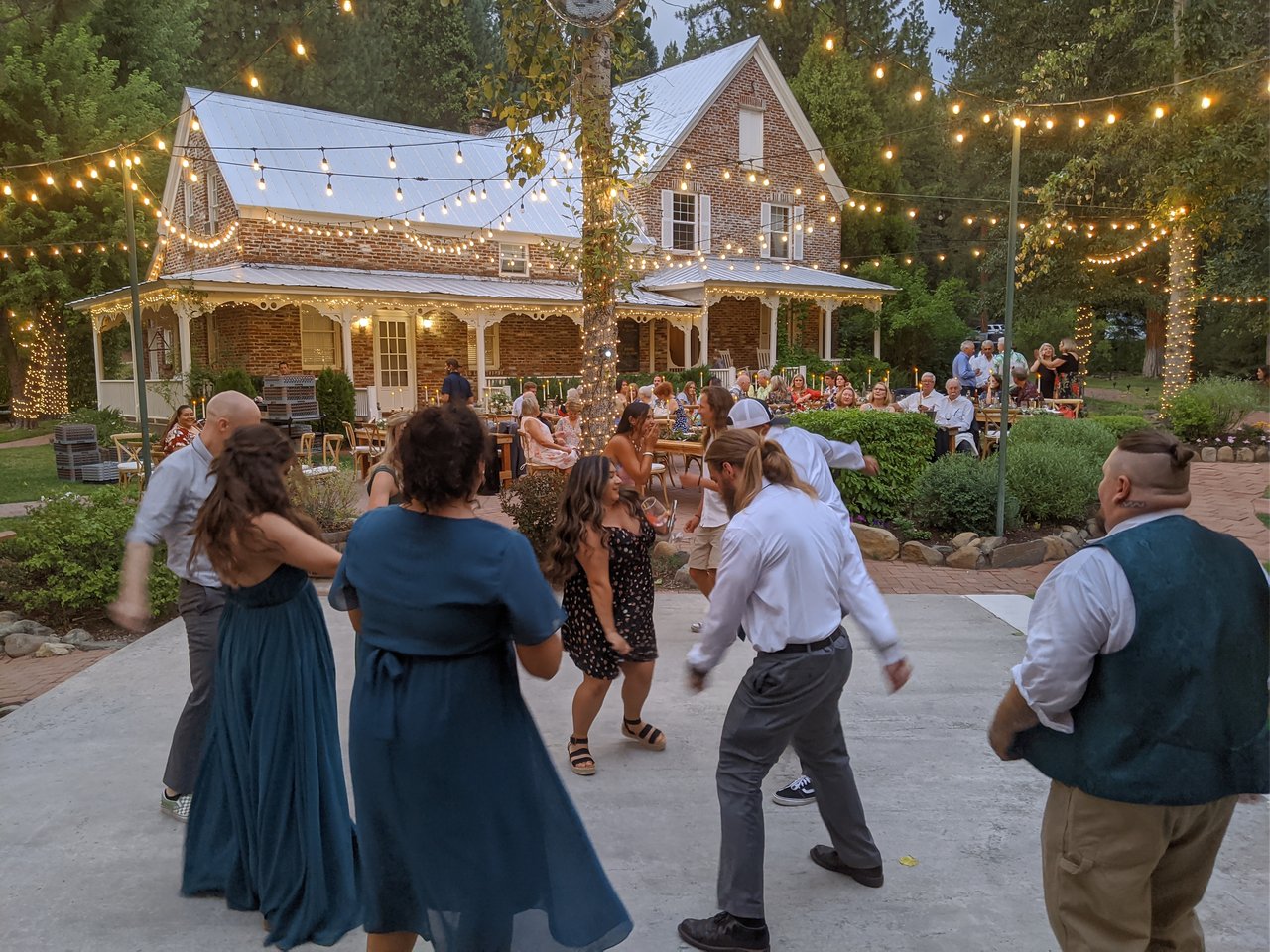 The dance floor fills up in the golden hour light at Twenty Mile House
