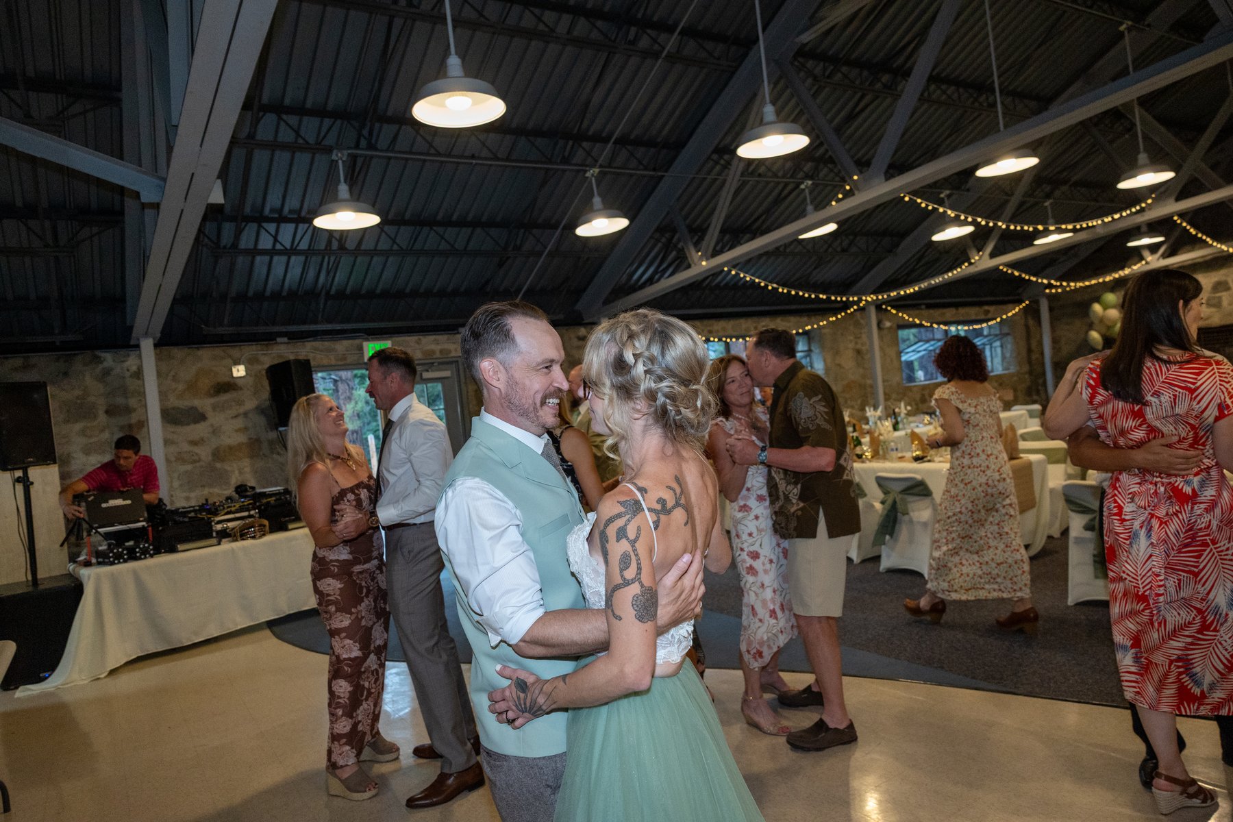 Amy and Justin dancing with their guests at the reception