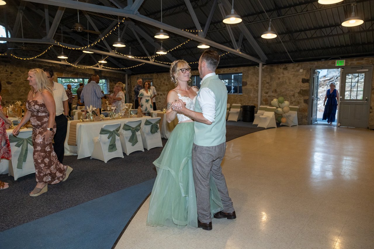 Amy and Justin share their first dance in the stone hatchery hall
