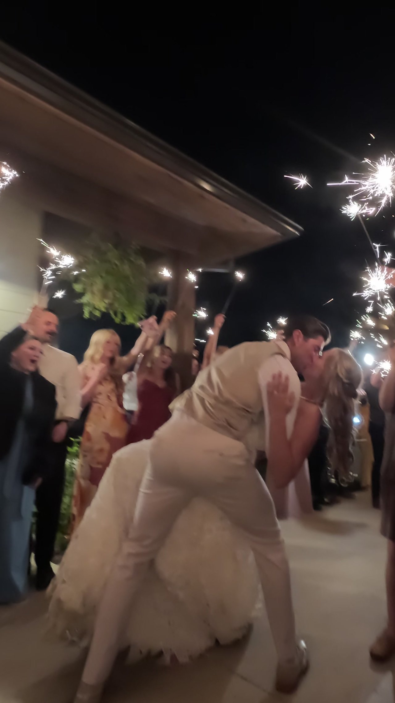 Wyatt dips Anabella for a kiss under the sparklers at the end of the night