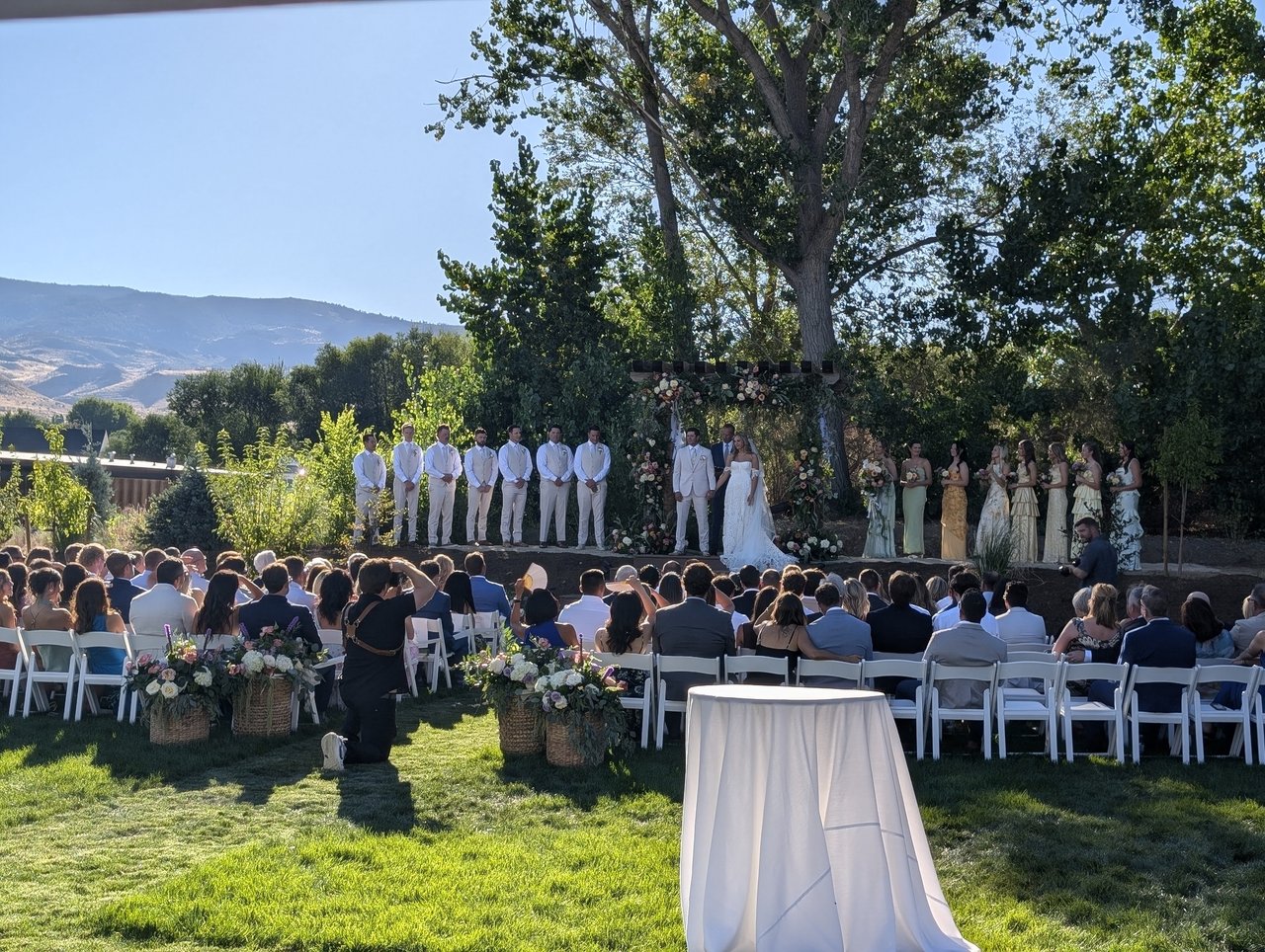 Anabella and Wyatt's ceremony on the lawn of the family ranch, the hills of Reno behind them
