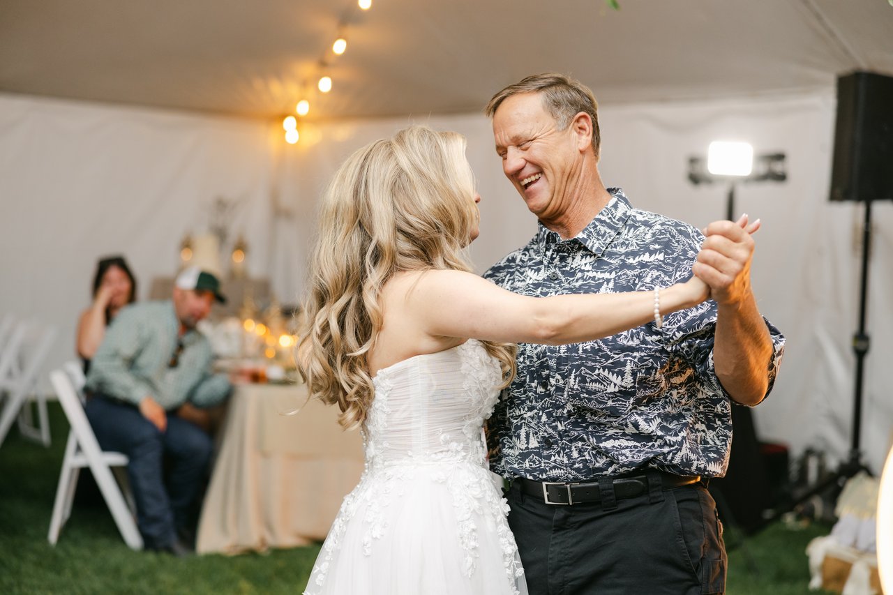 Britt laughs while dancing with her dad