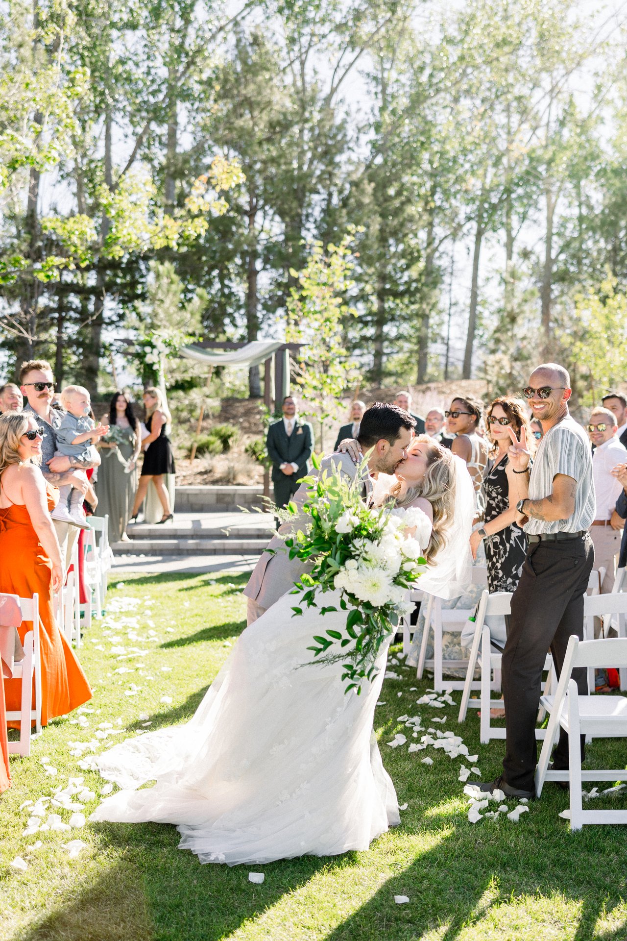 Britt and Chris kiss halfway up the aisle