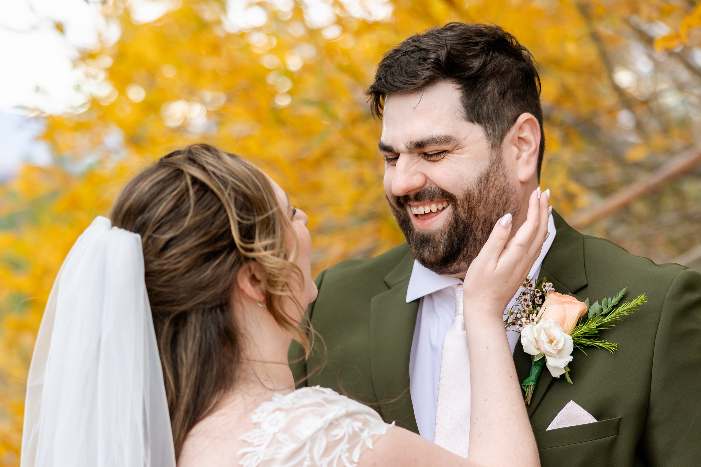 Danielle and Brandon smile together under the golden aspens at Tannenbaum