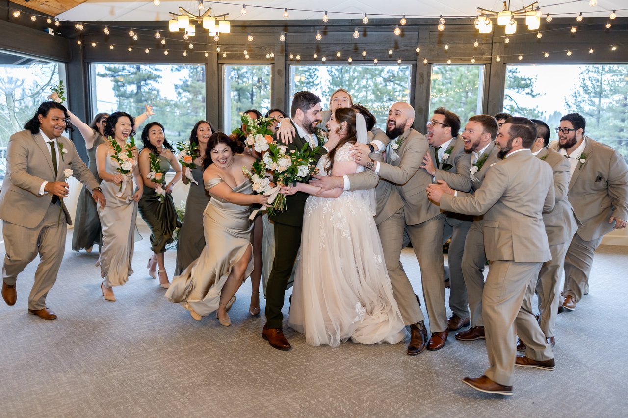The wedding party rushes in around Danielle and Brandon