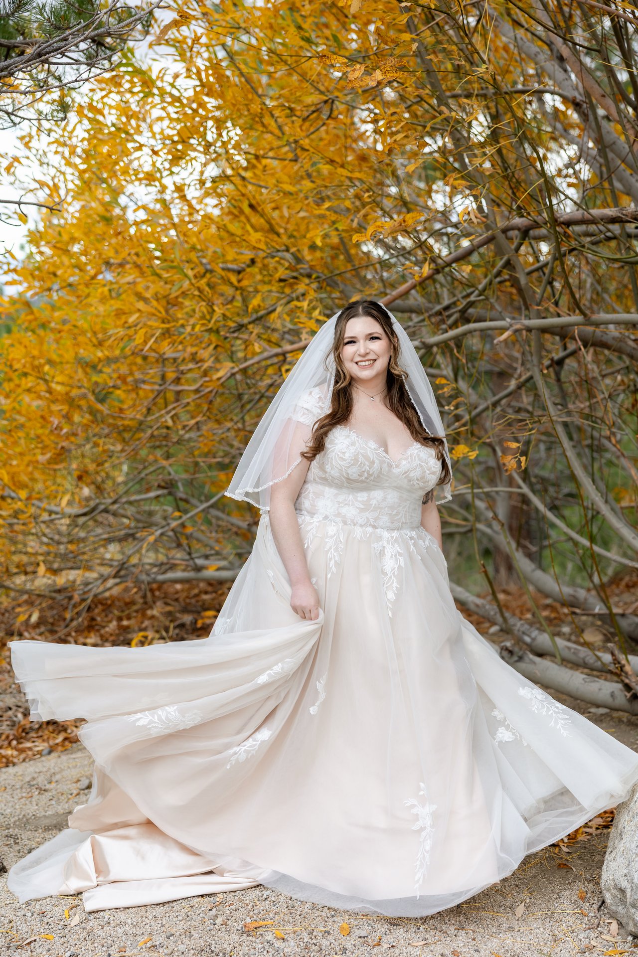 Danielle spins her skirt under the yellow aspens