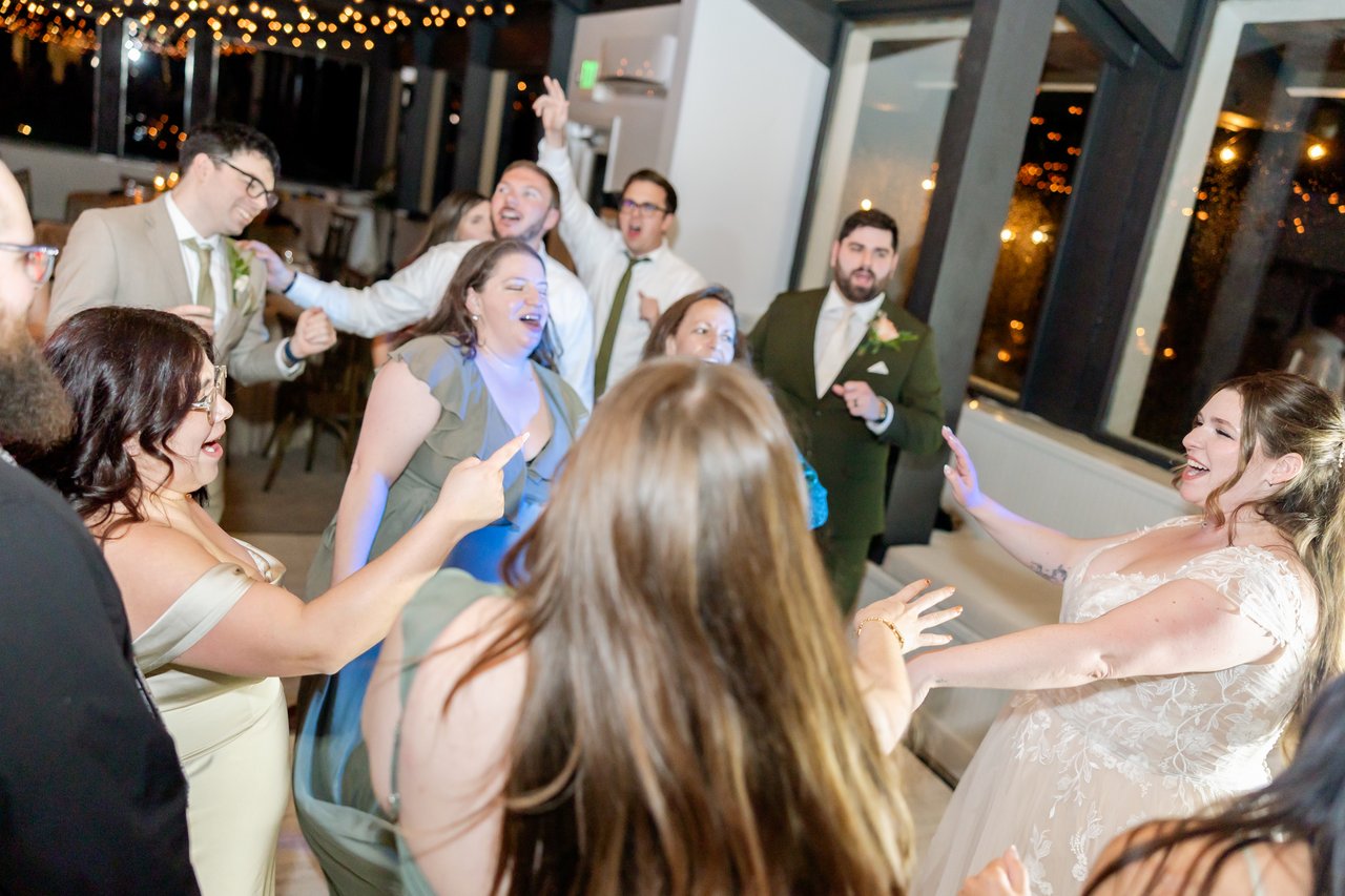 Danielle sings in the middle of a packed dance floor