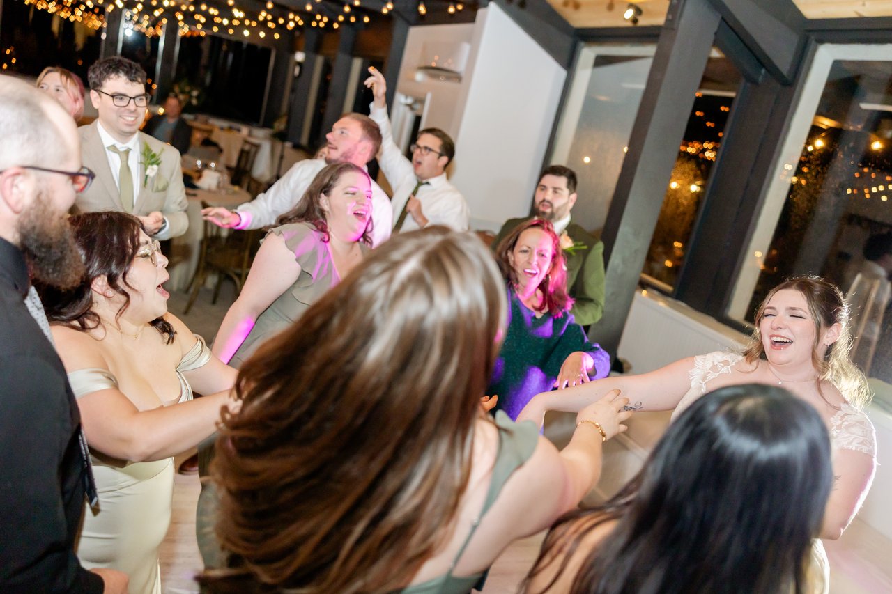 Guests sing along on the dance floor
