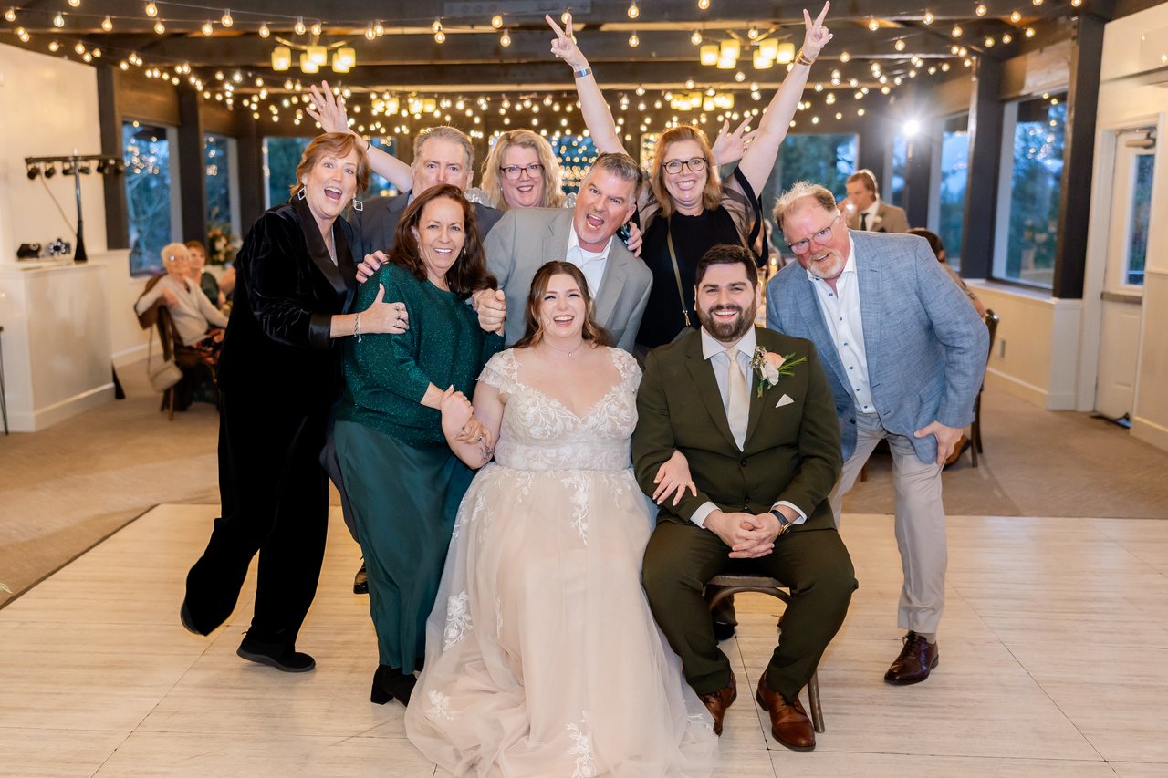 Family hams it up around Danielle and Brandon on the dance floor