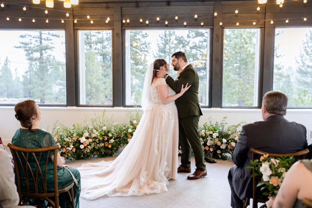 Danielle and Brandon share their first kiss in front of the windows