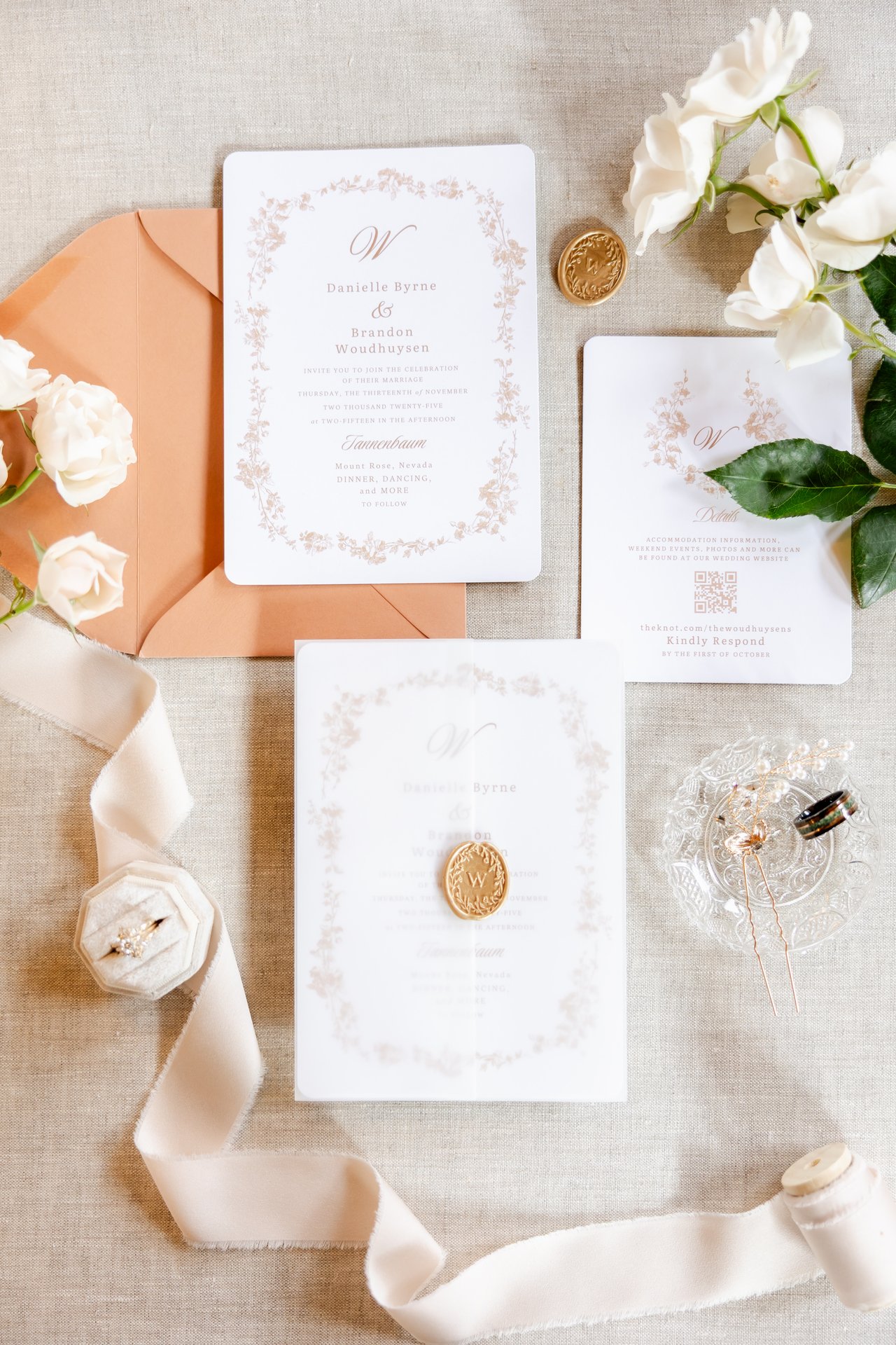 Danielle and Brandon's invitation suite with a peach envelope and a wax seal