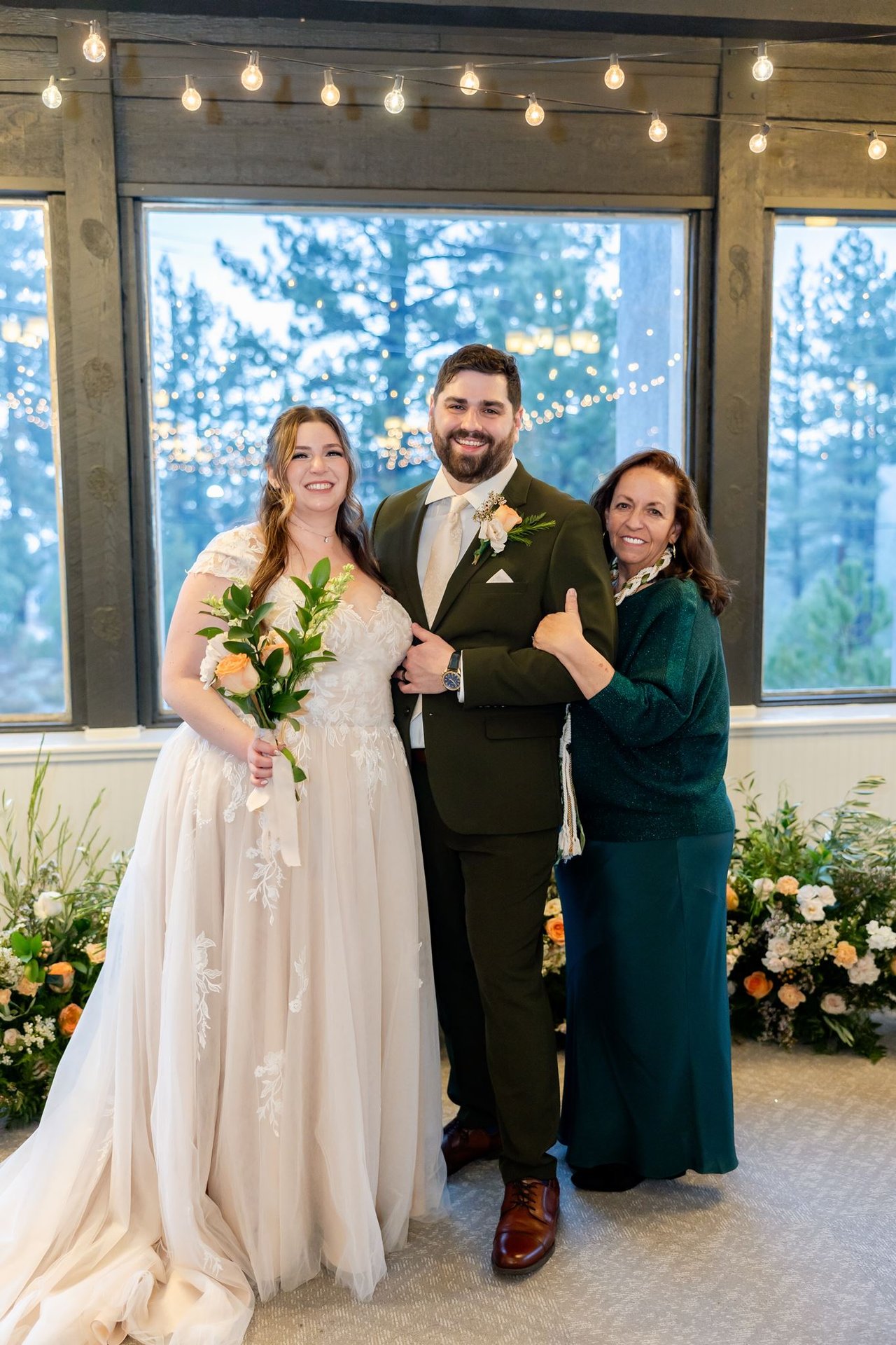 Brandon gives a thumbs up with Danielle and his mom
