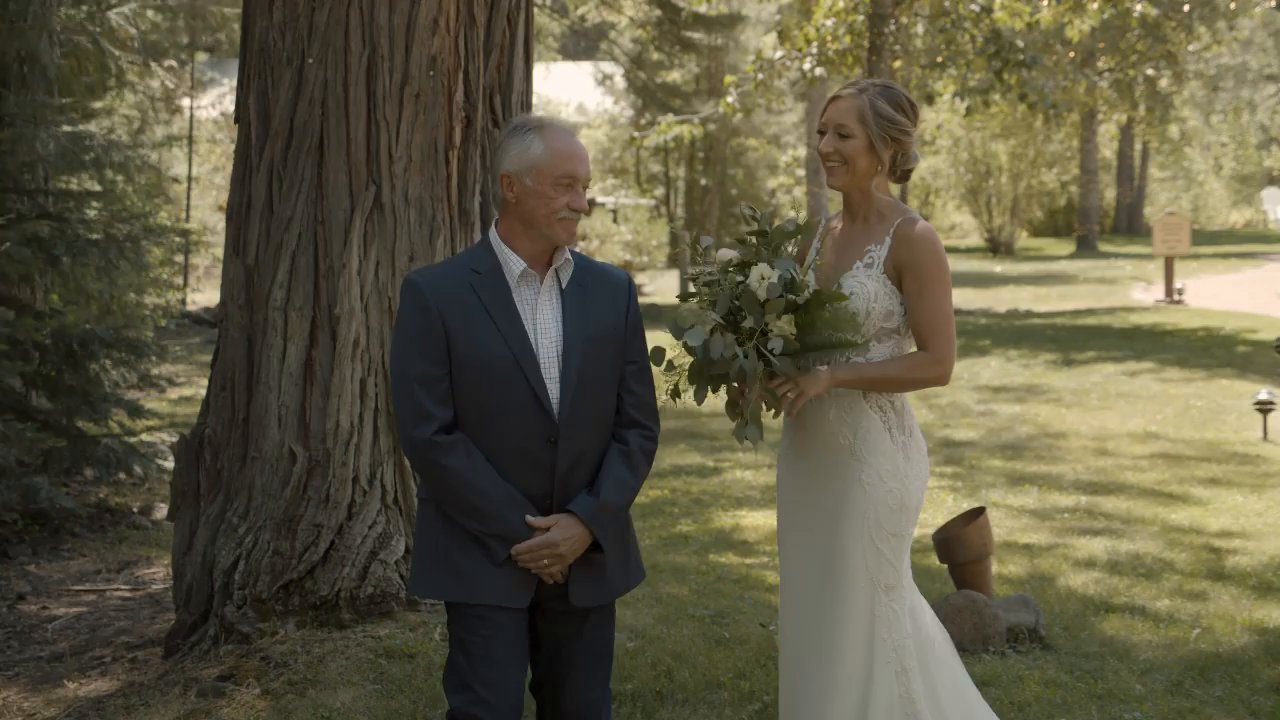 Danielle's dad turns to see her for the first time in her gown.