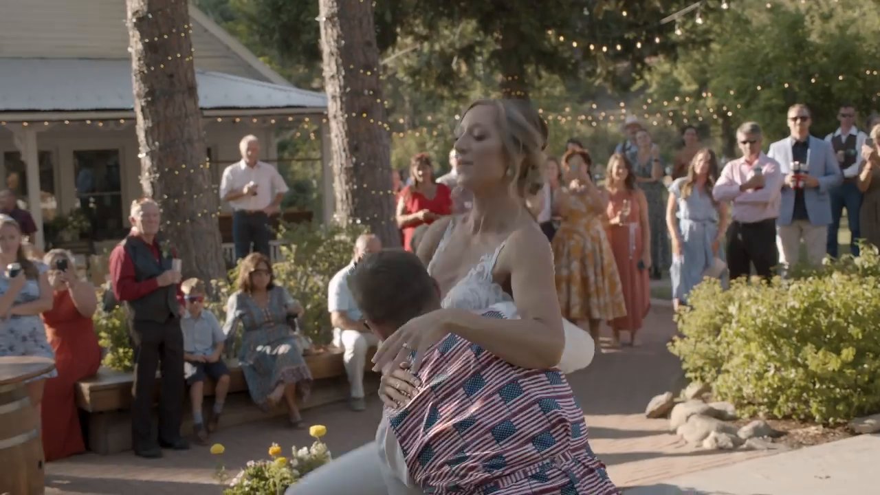 Scott dips Danielle low at the end of their first dance.