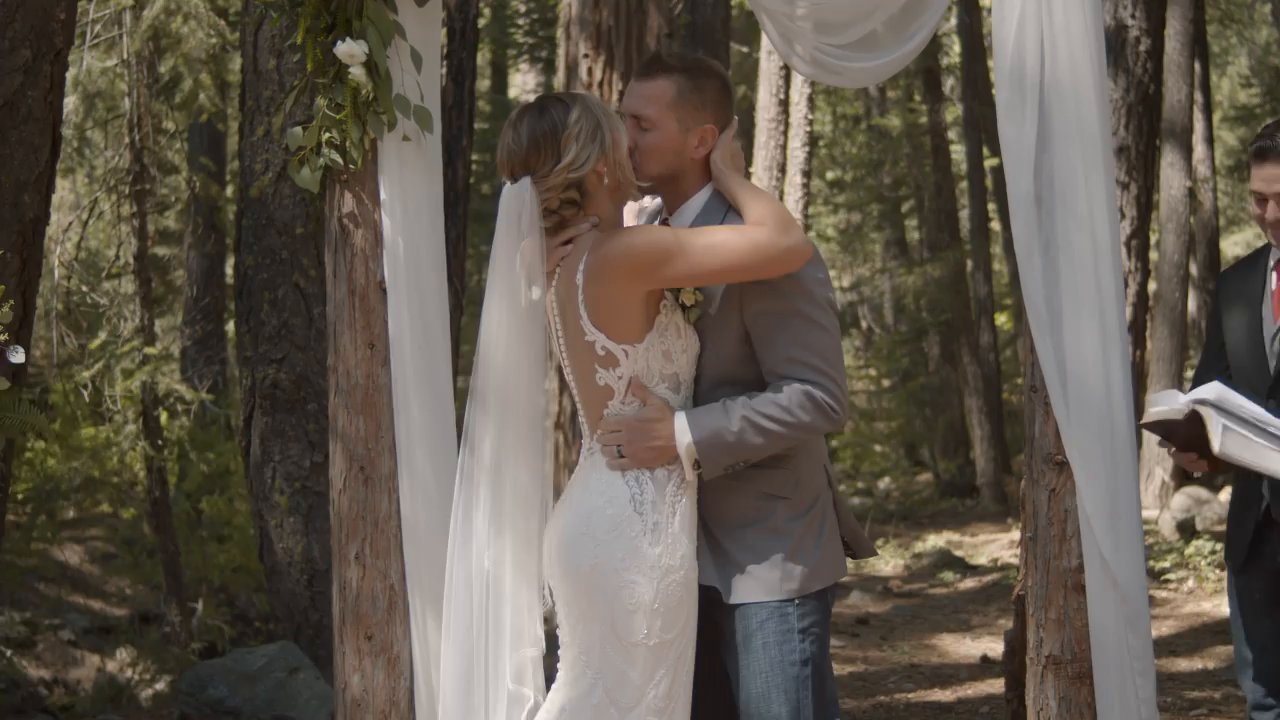 Danielle and Scott share their first kiss as husband and wife under the arch.