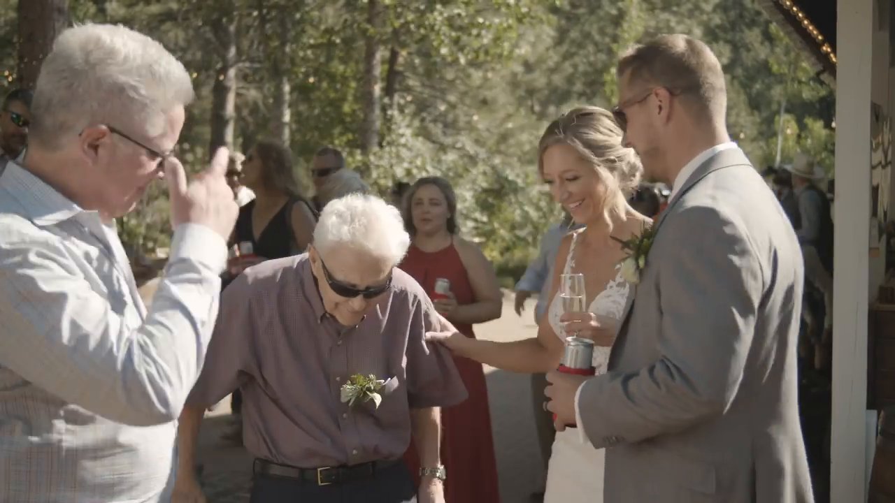 Danielle and Scott greet older family members on the patio.