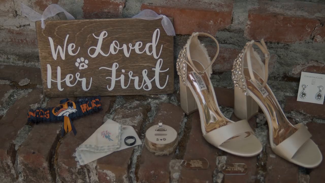 The We Loved Her First sign, her sparkling heels and the wedding day details on the brick.