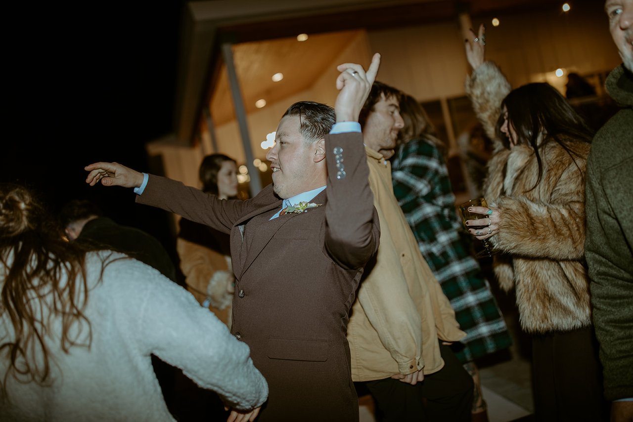 Devin throws his arms out on the packed dance floor