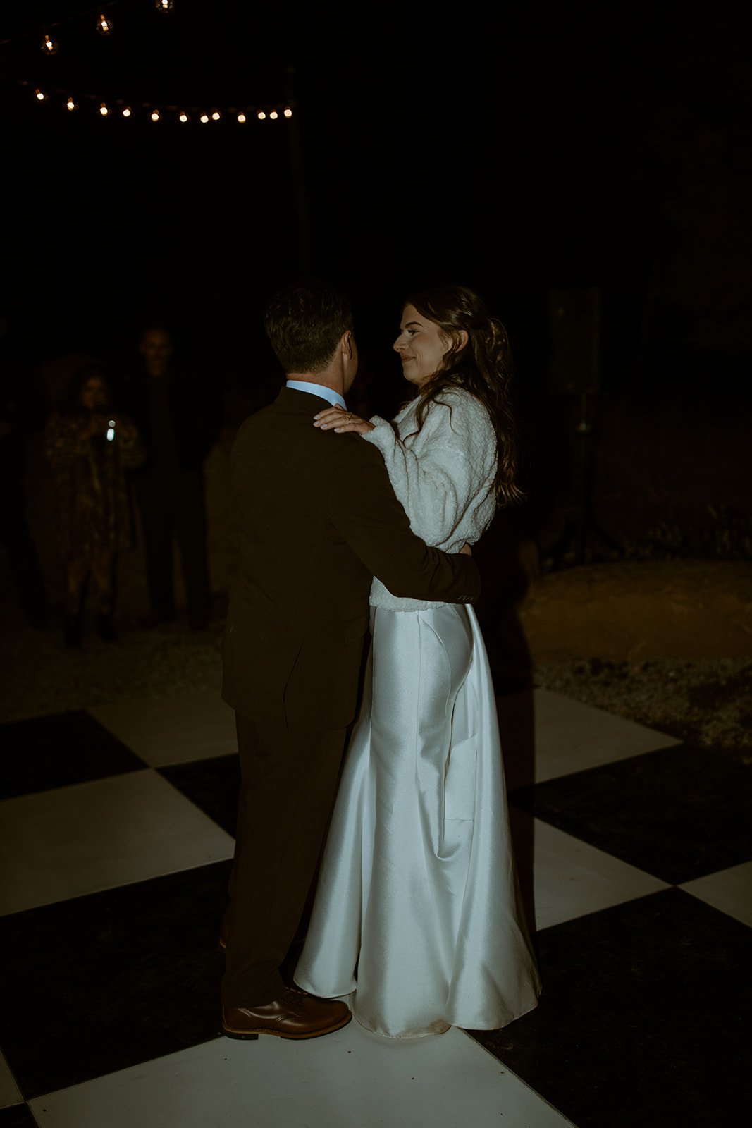 Emily and Devin's first dance on the black and white dance floor