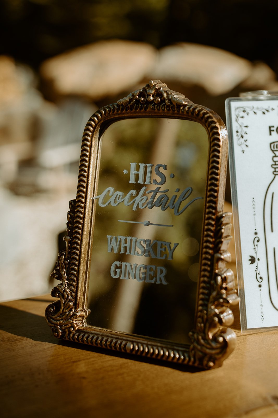 A mirror sign for his cocktail, whiskey ginger