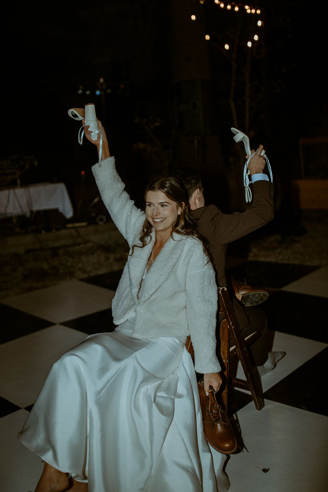 Emily holds up a shoe during the shoe game