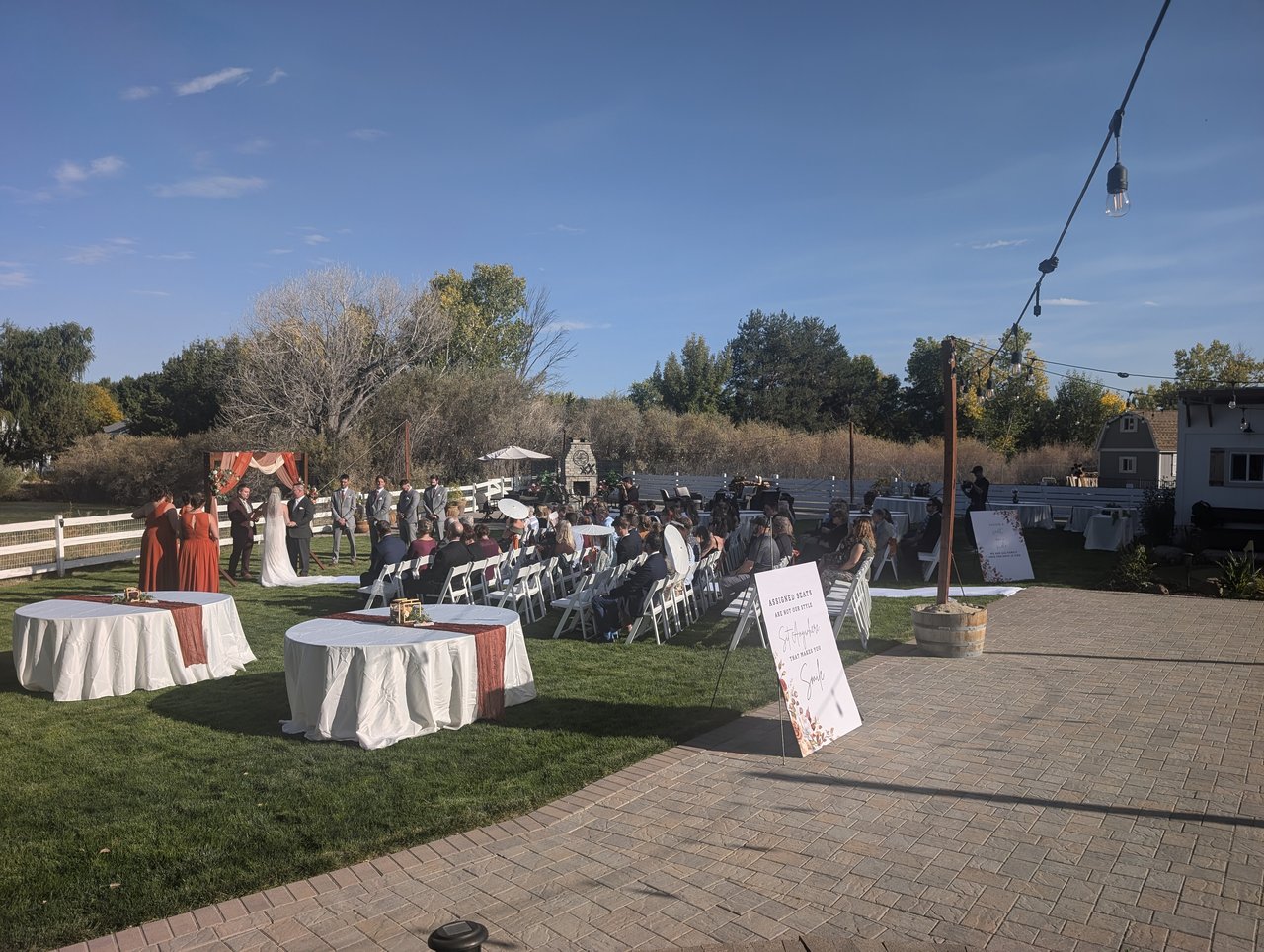 Guests watch the unplugged ceremony on the lawn at the John Olive Estate