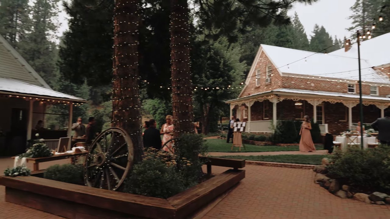 The courtyard and lodge at dusk under the string lights