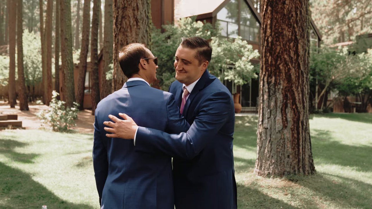 Wes hugs a friend on the lawn before the ceremony