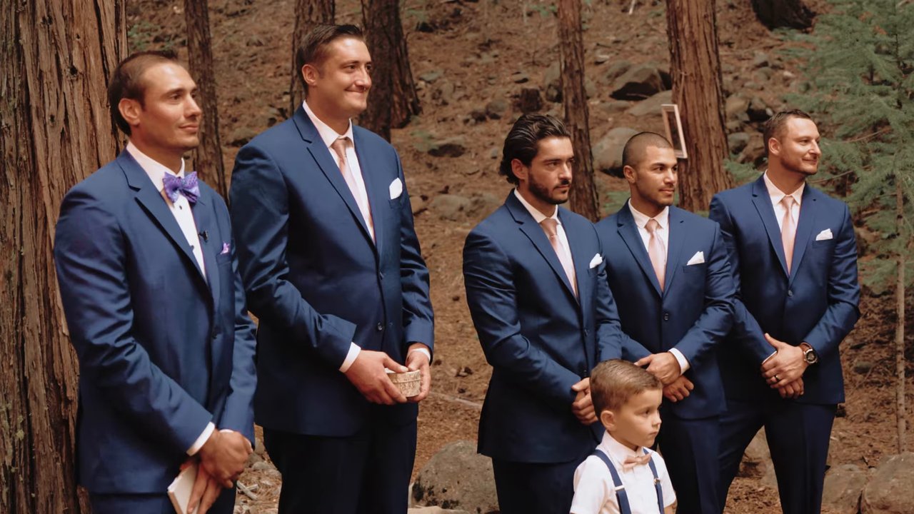 Wes and his groomsmen wait at the front of the forest ceremony