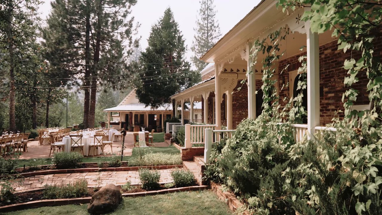 The lodge garden set with tables for the reception