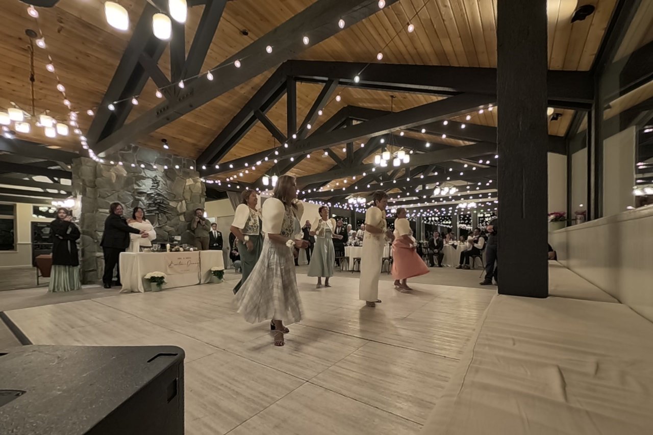 The Star Ladies spin across the dance floor in front of the stone fireplace