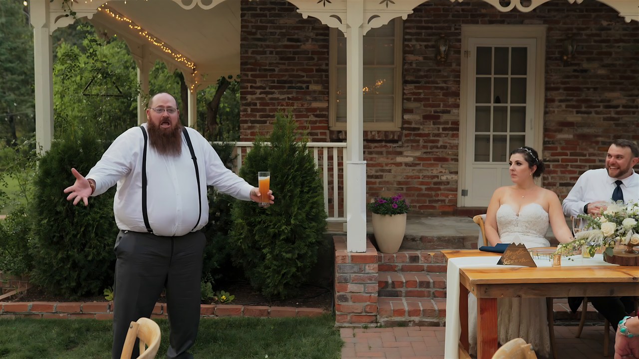 The best man raises a toast to the newlyweds