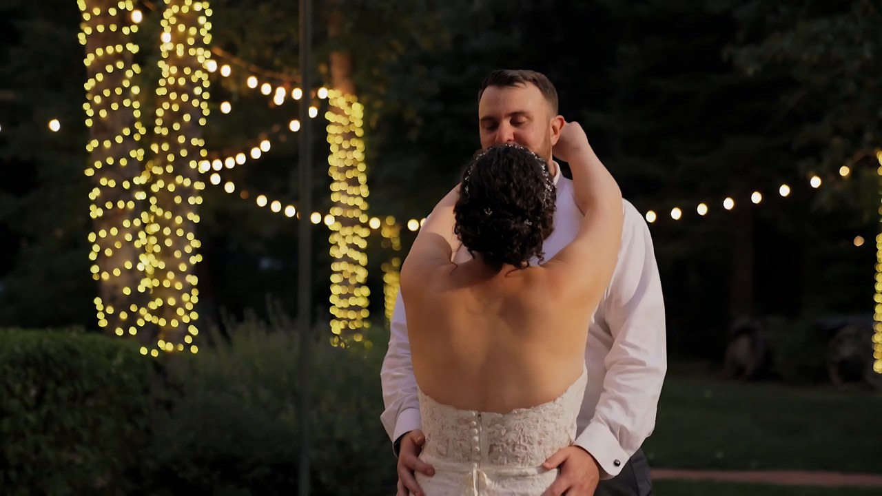 Jessie and Jeff share their first dance under the string lights