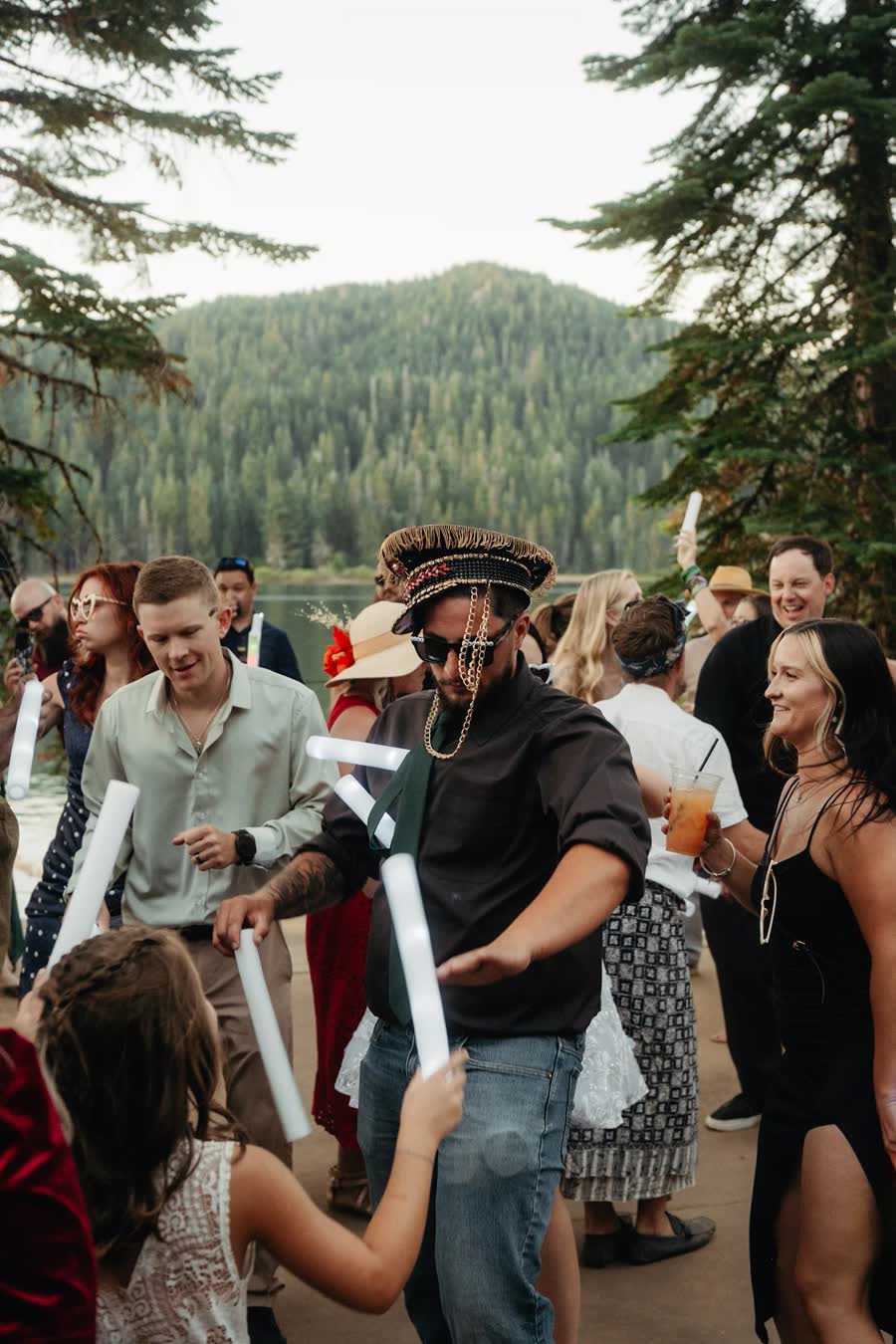 Guests dancing beside the lake at golden hour at Bucks Lake