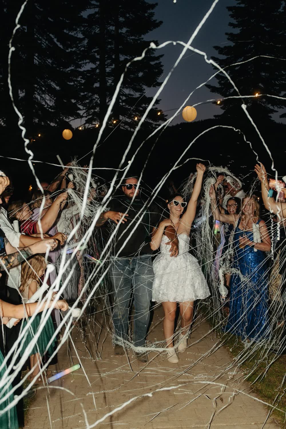 Kaitlyn dances as streamers fly through the night air at Bucks Lake