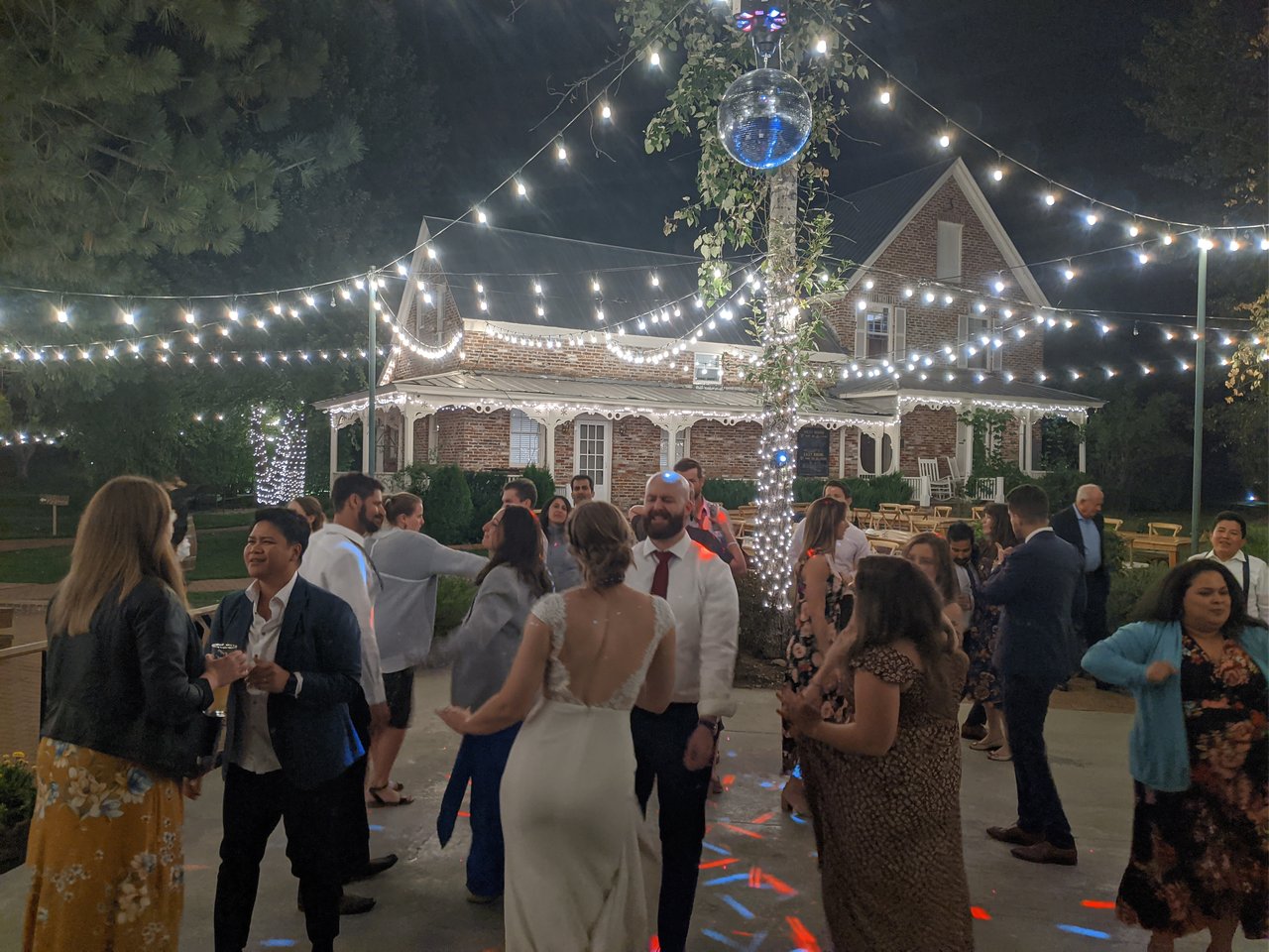 Lauren dances with her friends on the lawn dance floor