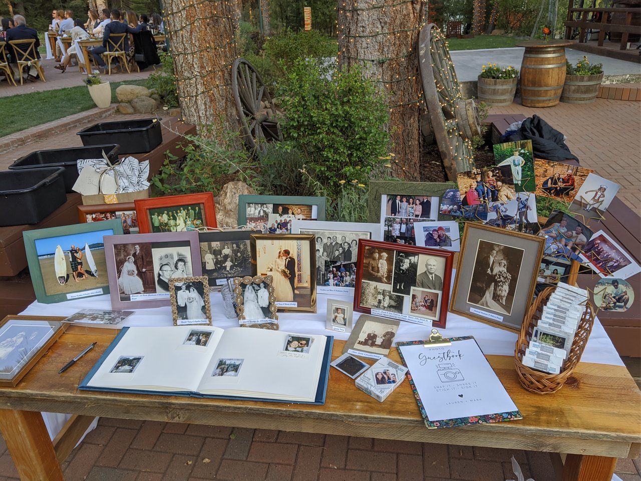 The guestbook table with framed family wedding photos for Lauren and Mark's guests