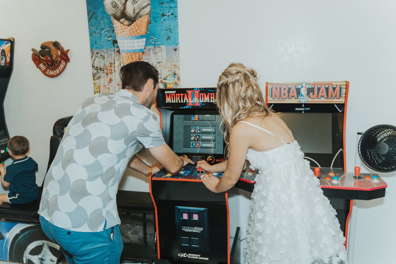 Lexy and Jeremy playing an arcade cabinet