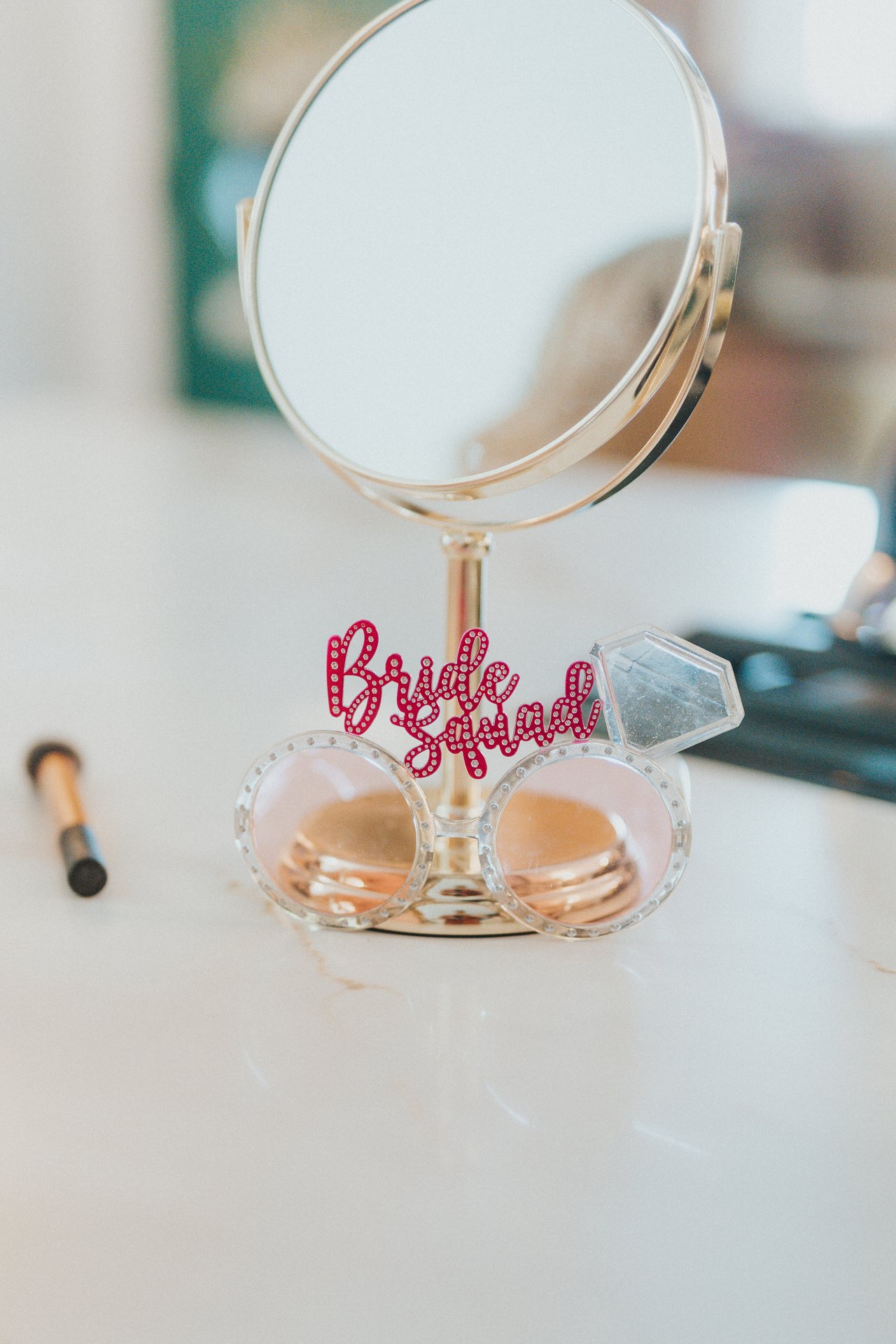 A Bride Squad mirror on the getting ready table
