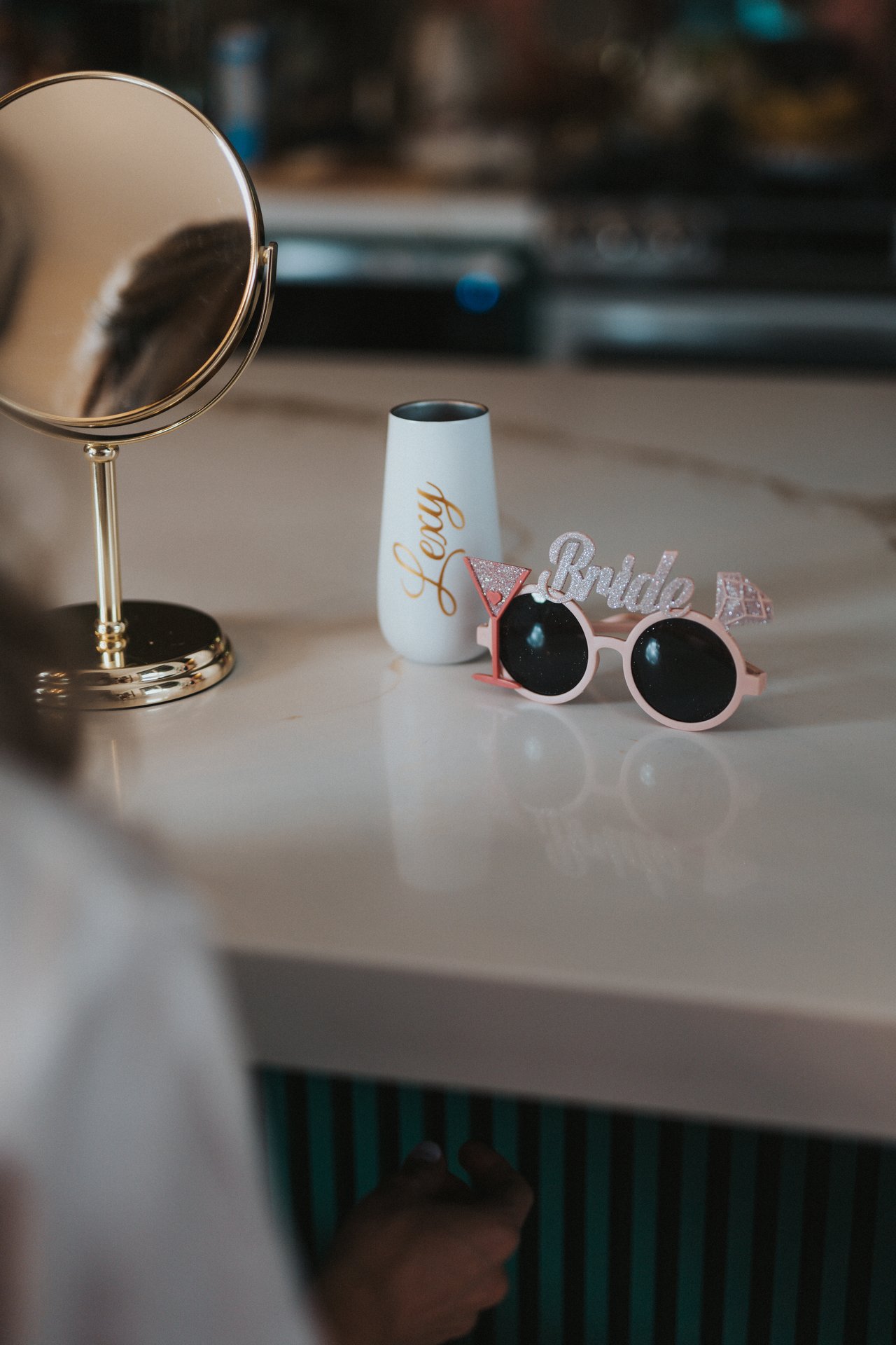 Bride sunglasses and a tumbler on the getting ready table