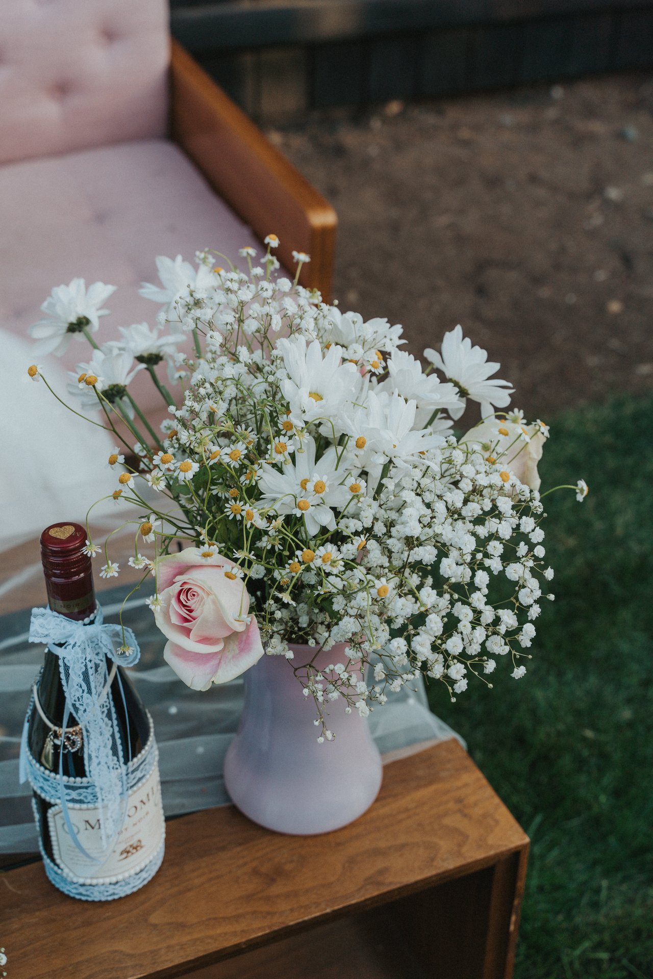 Wildflowers and wine by the sweetheart couch