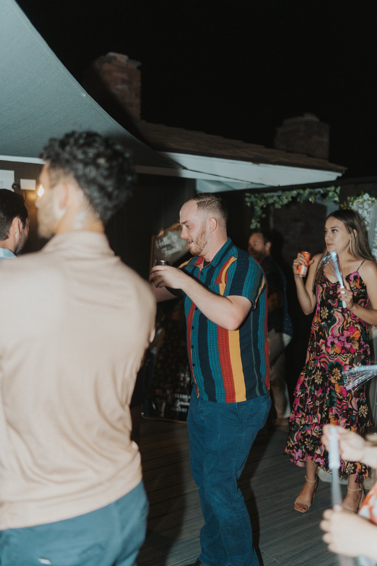 Guests dancing under the shade sail
