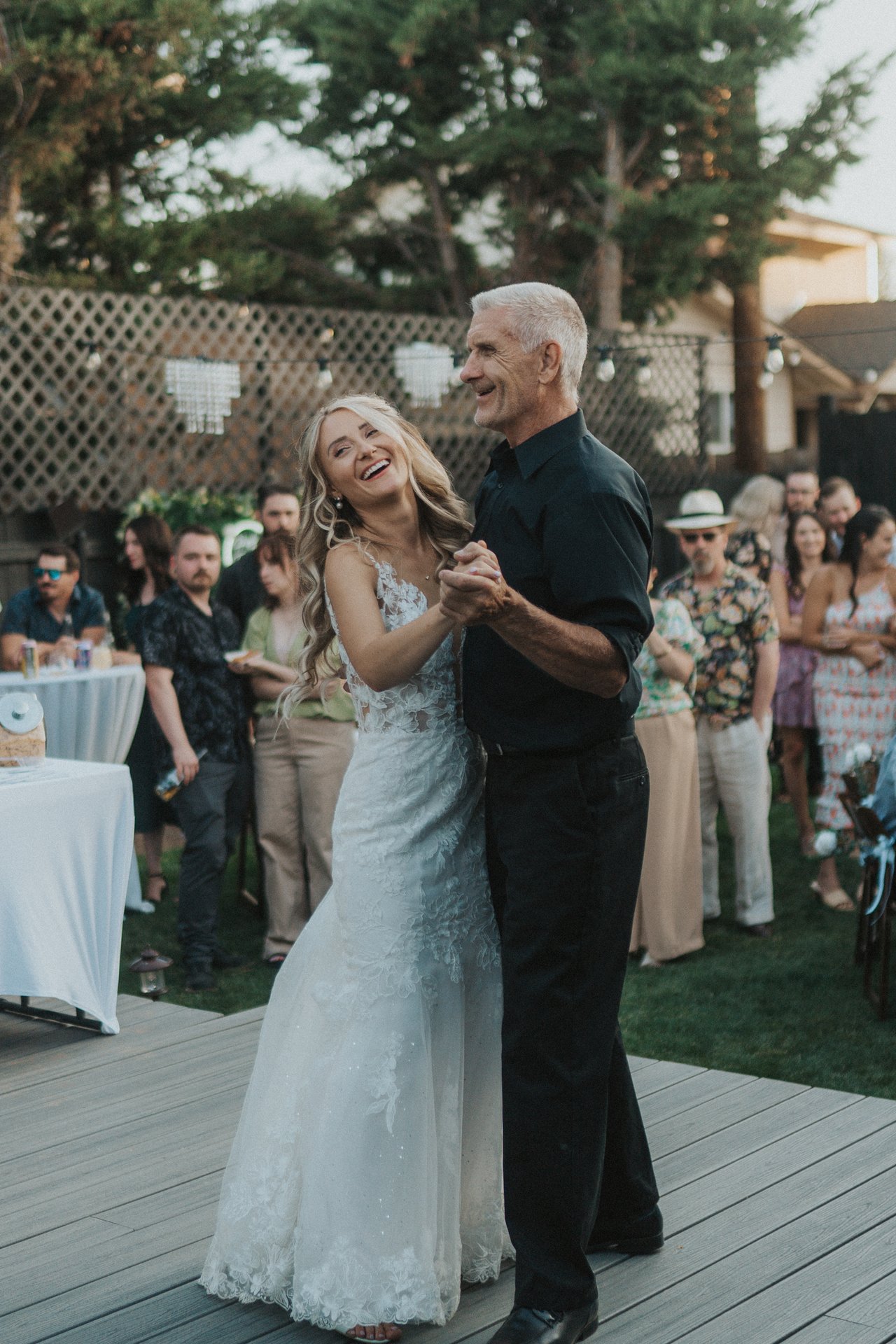 Lexy laughs dancing with her dad