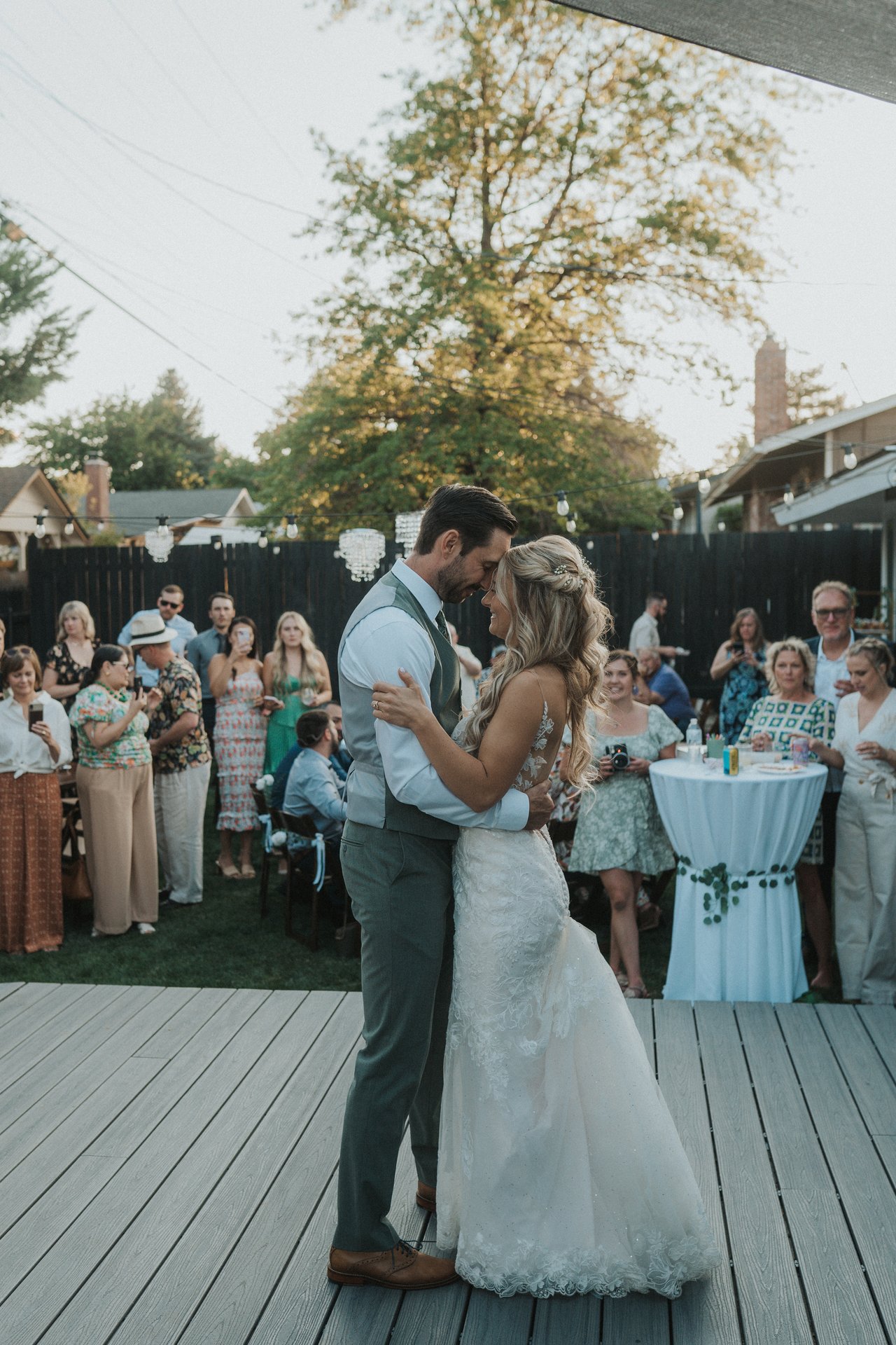 Lexy and Jeremy share their first dance on the deck