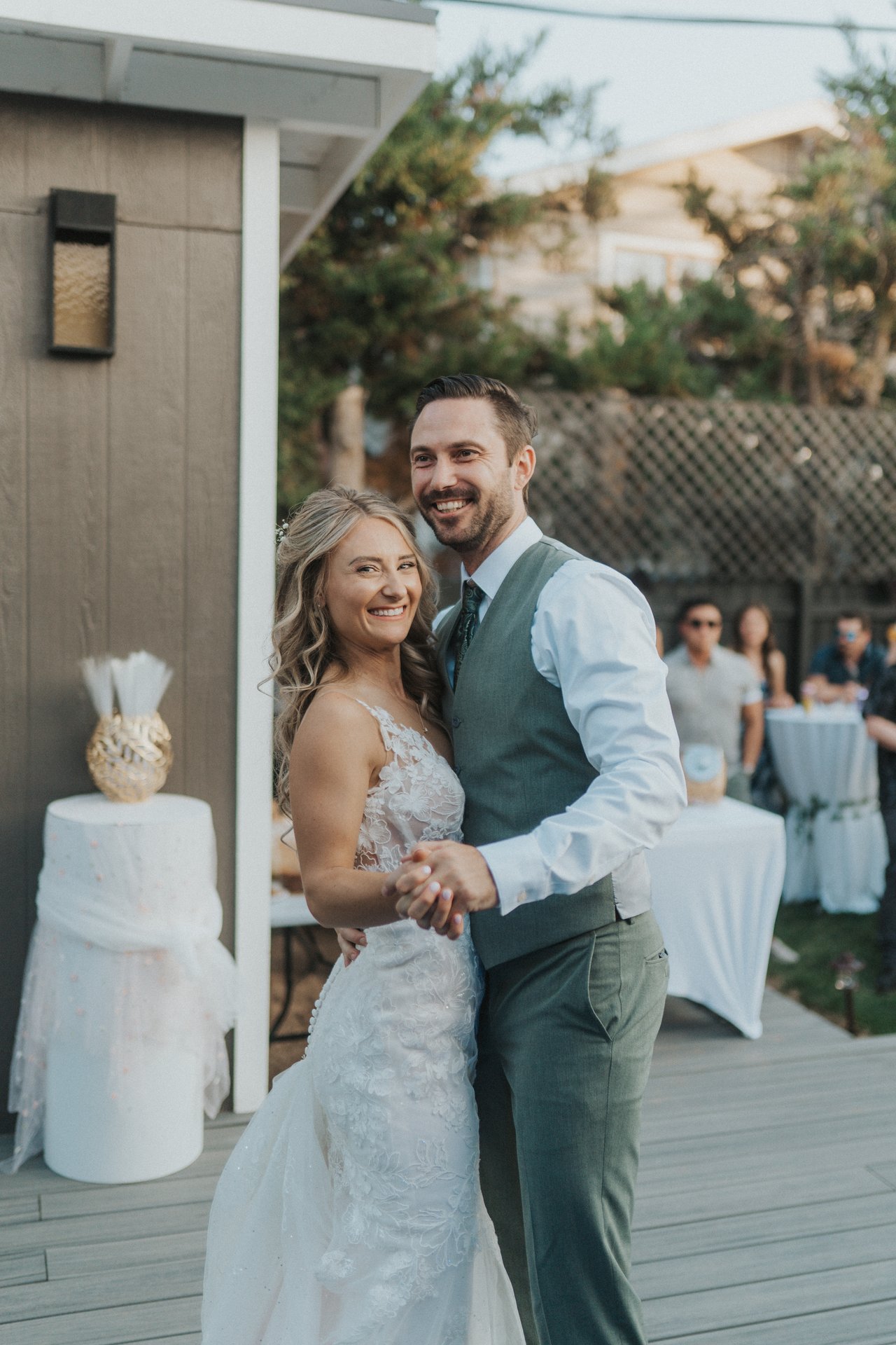 Lexy and Jeremy smile during their first dance