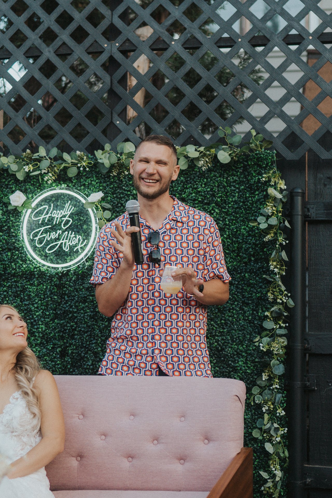 A friend laughs during his toast