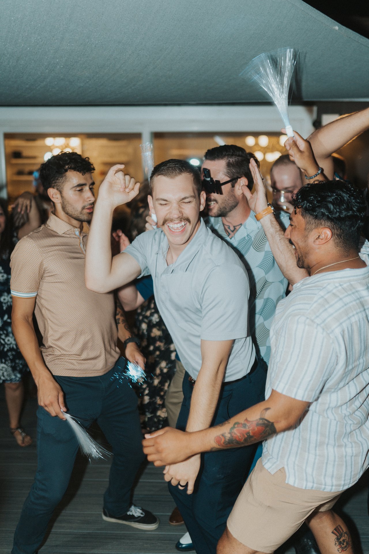 Friends laughing on the dance floor